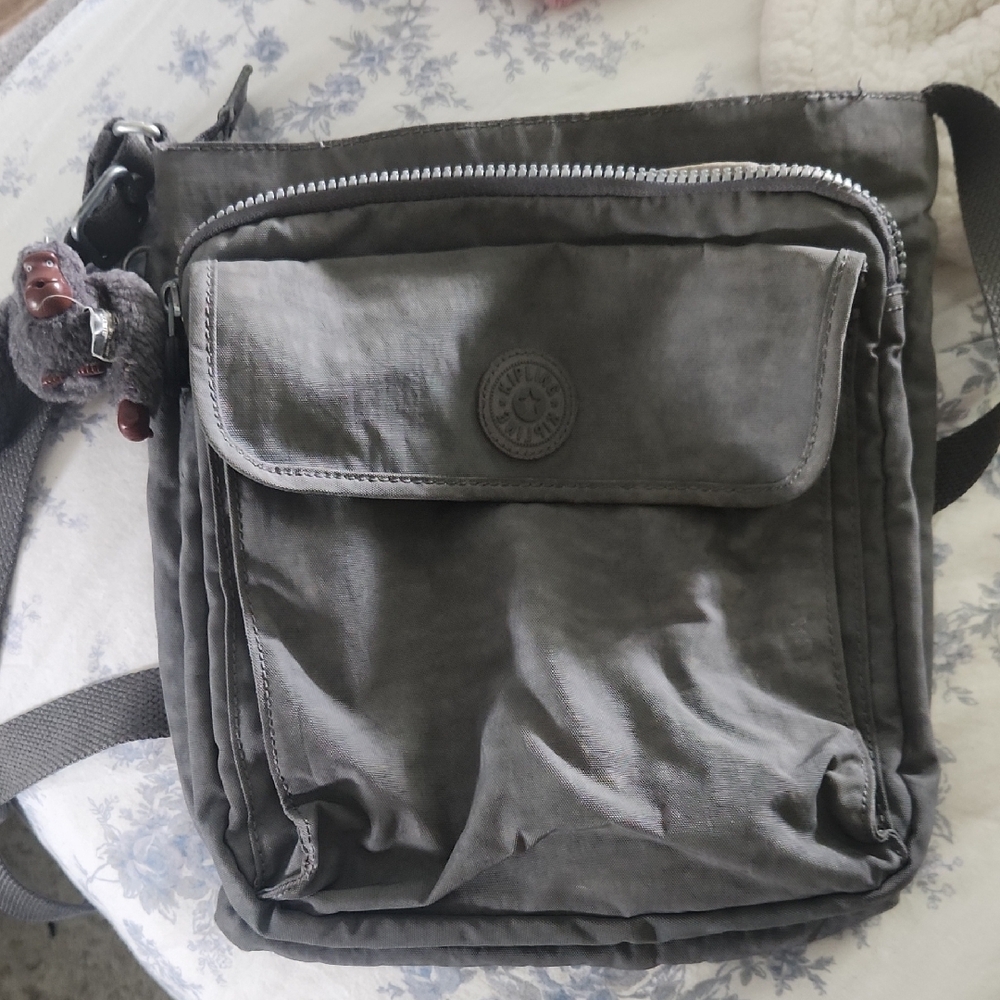 Kipling Gray Crossbody Bag with Adjustable Strap and Circular Logo